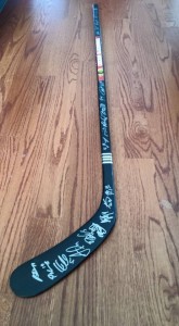 Blackhawks hockey stick signed by the team and a Brent Seabrook bobblehead